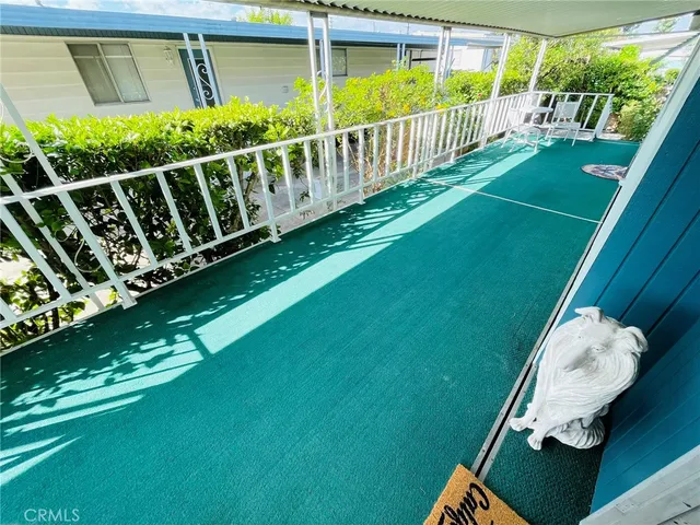a view of a deck with a yard