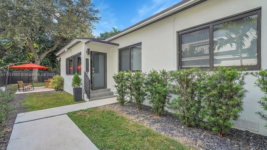 3764 Southwest 27th Lane, Unit 3762 Miami, FL 33134 - Photo 2 of 31 a view of a house with backyard and garden