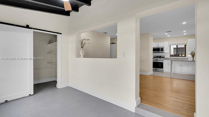 3764 Southwest 27th Lane, Unit 3762 Miami, FL 33134 - Photo 5 of 31 en view interior of the house and wooden floor