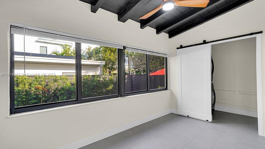 3764 Southwest 27th Lane, Unit 3762 Miami, FL 33134 - Photo 6 of 31 an empty room with windows