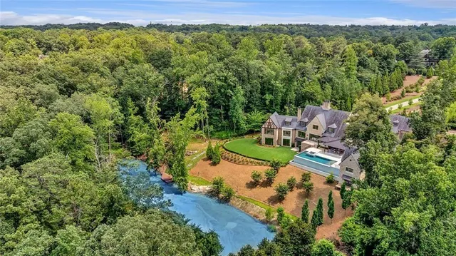 an aerial view of a house with outdoor space
