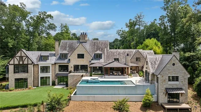 a view of living room kitchen and entryway