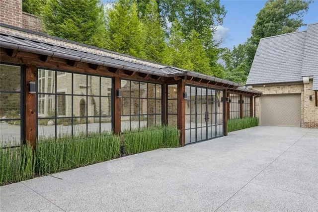 a spacious bedroom with a bed and a cabinets