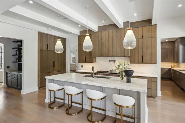 a bedroom with a large bed and a couch