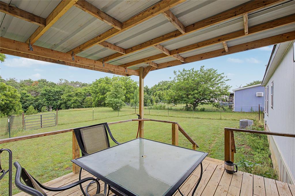6065 Timber Trail Azle, TX 76020 - Photo 22 of 33 a view of a swimming pool with a patio