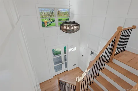 a bedroom with a large bed and a dresser