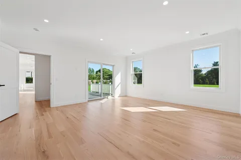 a view of room with window and hardwood floor