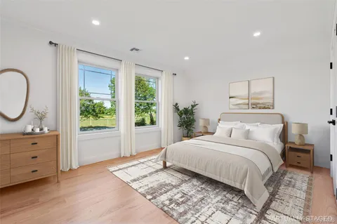 a view of houses with outdoor space and ocean view