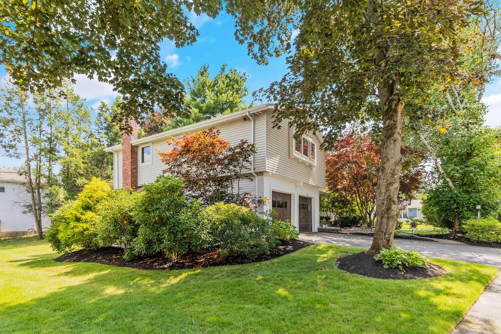 124 Damon Road Needham, MA 02494 - Photo 2 of 42 a front view of a house with garden
