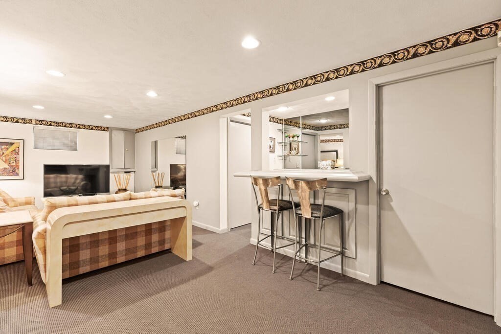 124 Damon Road Needham, MA 02494 - Photo 33 of 42 a large bedroom with a bed and a table in it