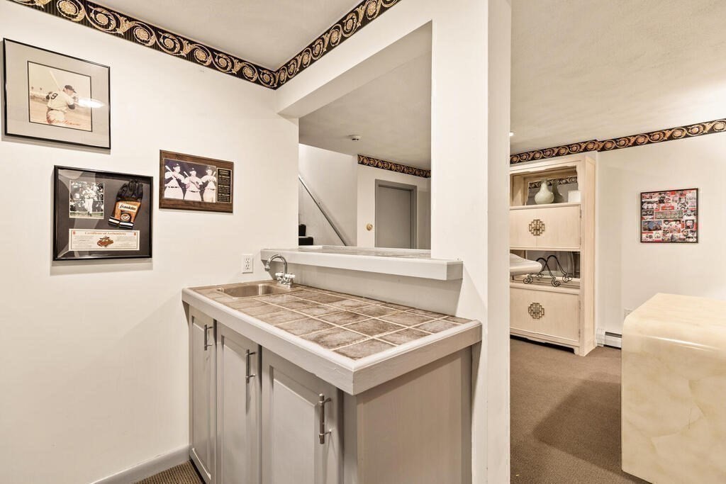 124 Damon Road Needham, MA 02494 - Photo 35 of 42 a view of a hallway with washer and dryer