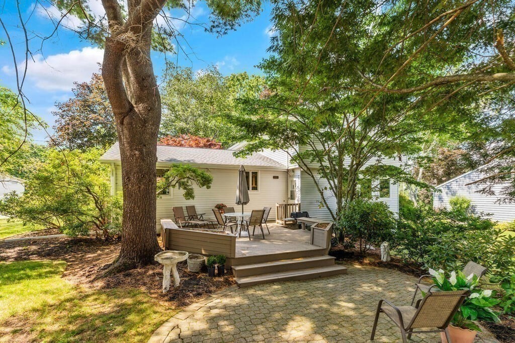 124 Damon Road Needham, MA 02494 - Photo 38 of 42 a view of a patio with table and chairs under an umbrella