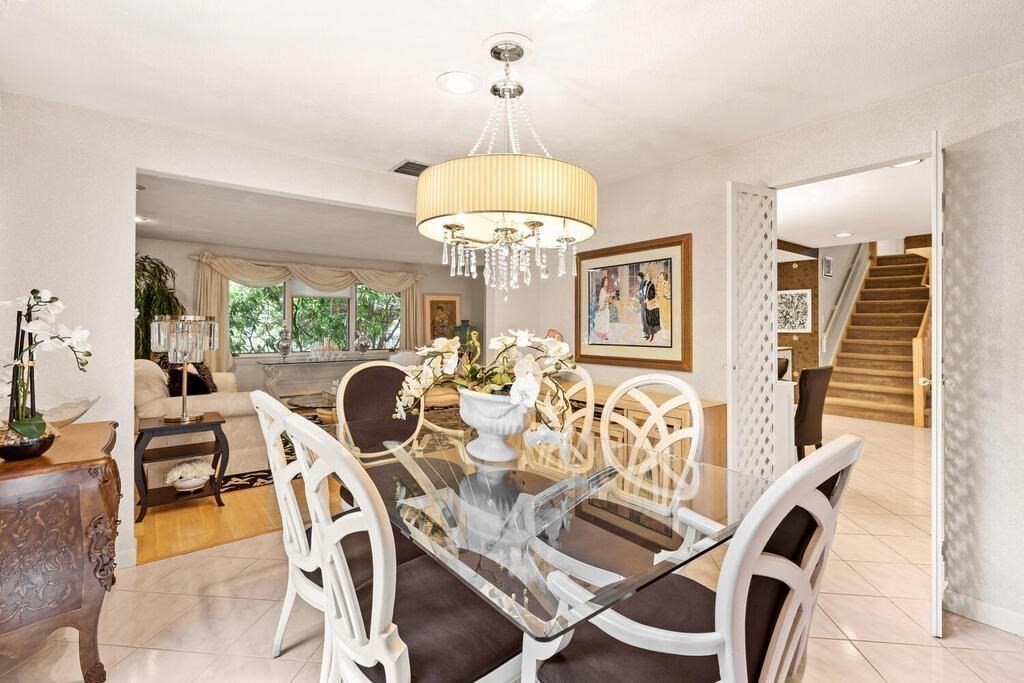 124 Damon Road Needham, MA 02494 - Photo 10 of 42 a view of a dining room with furniture and chandelier