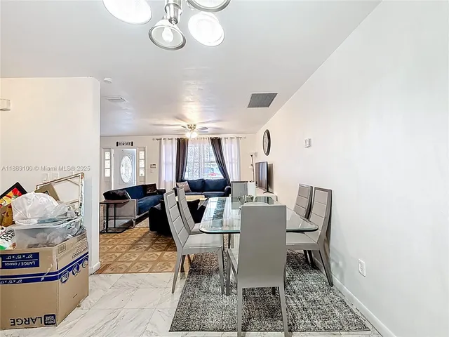 a kitchen with stainless steel appliances granite countertop a refrigerator stove and microwave