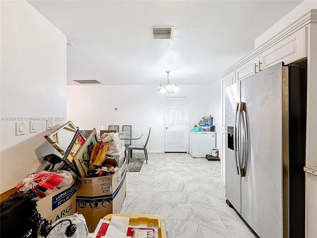 a living room with furniture and flat screen tv