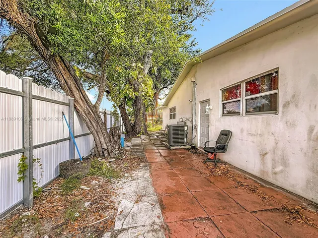 an aerial view of residential houses with outdoor space and street view