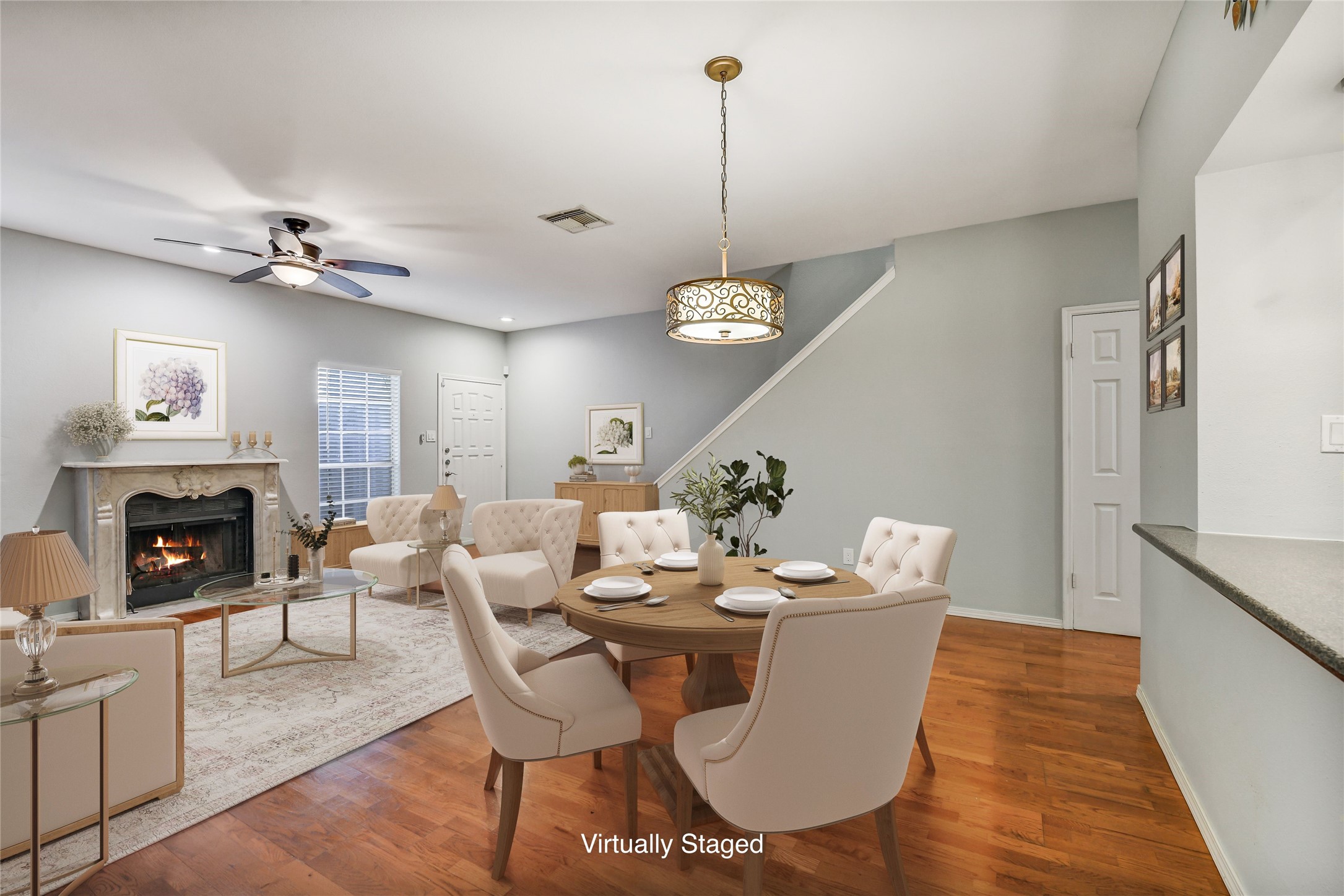 4001 Tanglewilde Street, Unit 1402 Houston, TX 77063 - Photo 6 of 23 Discover a charming blend of living and dining in this inviting space, anchored by a traditional fireplace mantel, offering front views to the patio and a convenient understair storage closet.