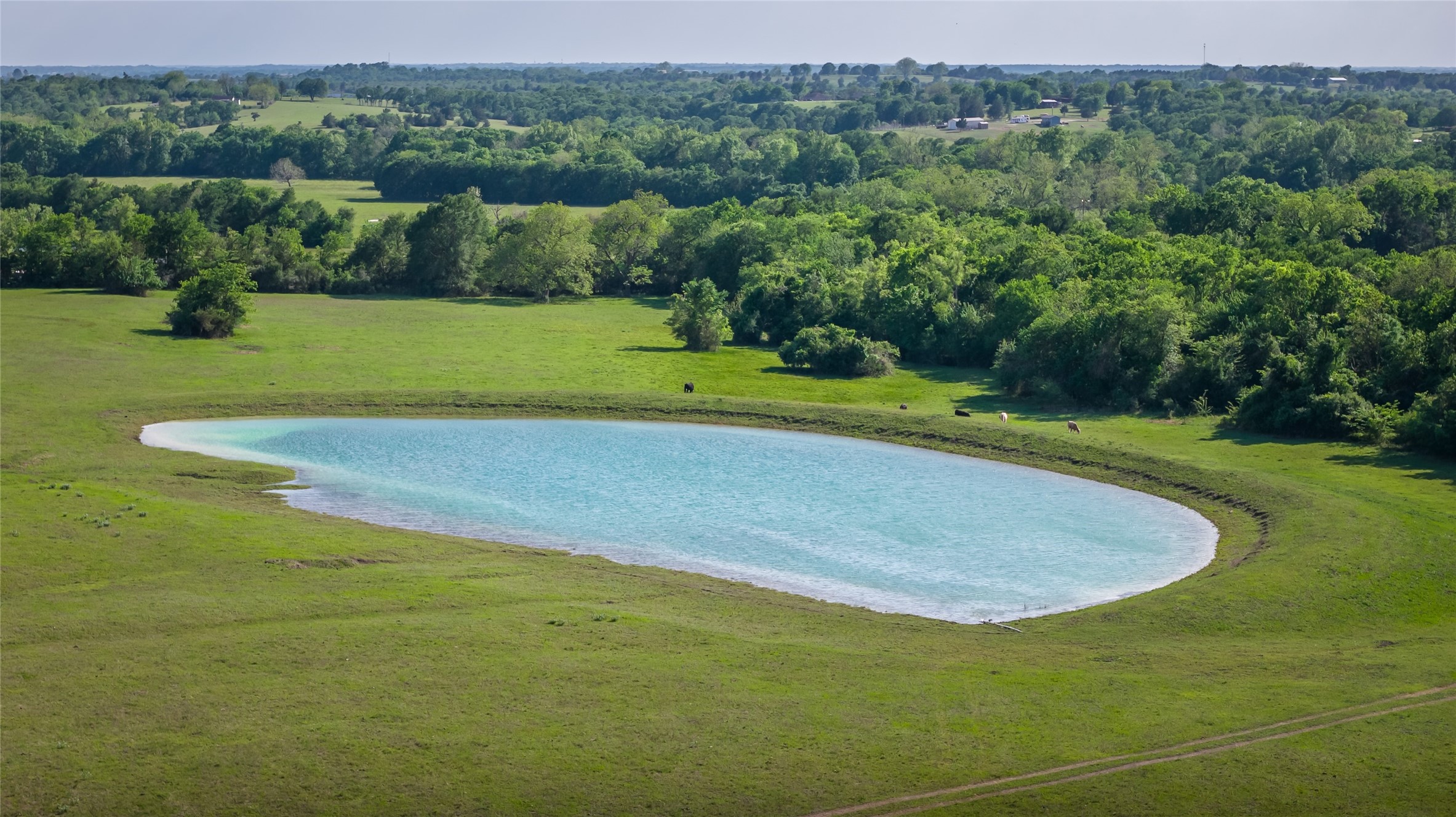 4201 Krueger Road Washington, TX 77880 - Photo 1 of 31 a view of a golf course with a lake