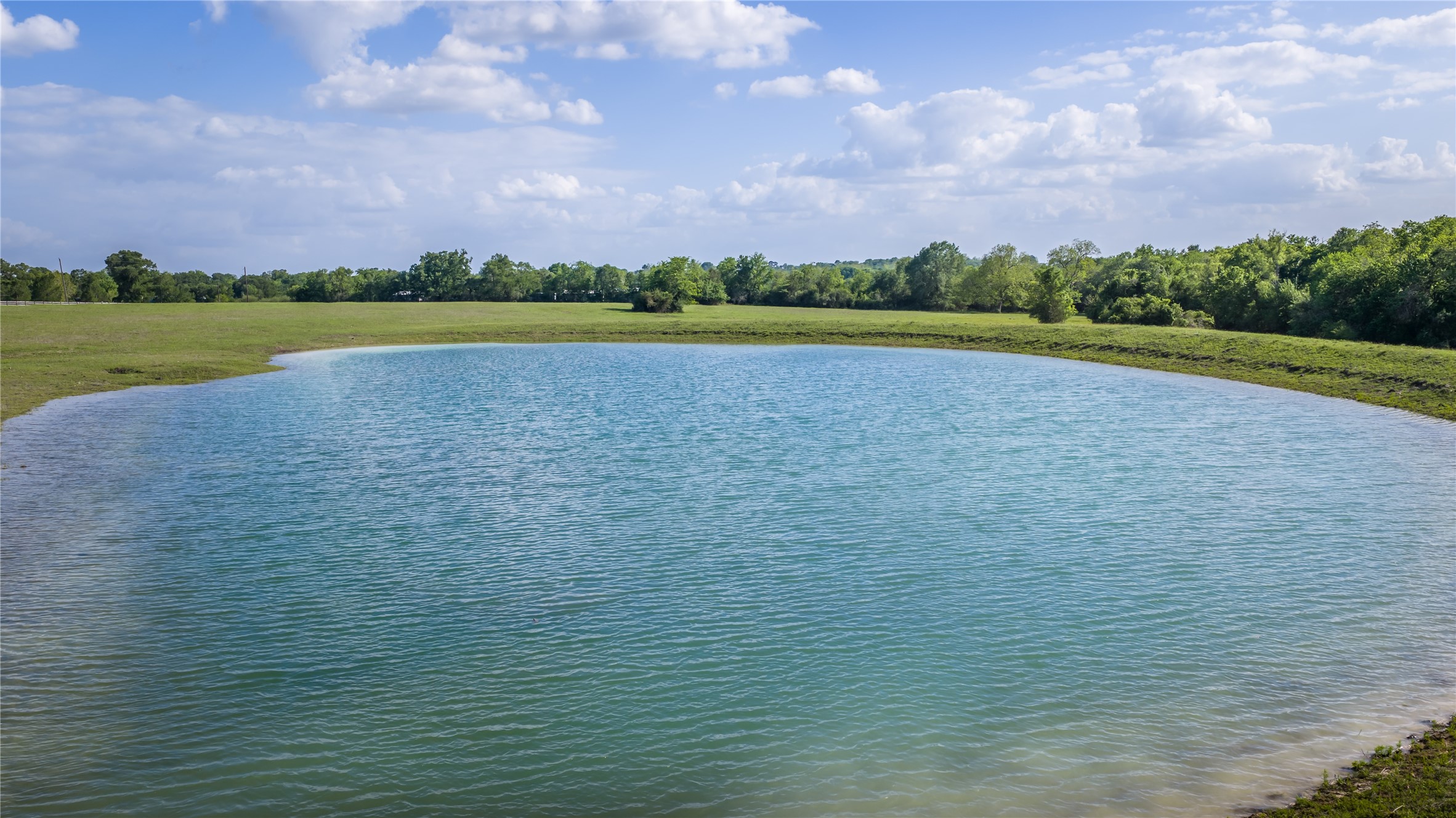 4201 Krueger Road Washington, TX 77880 - Photo 26 of 31 a view of a lake with a big yard