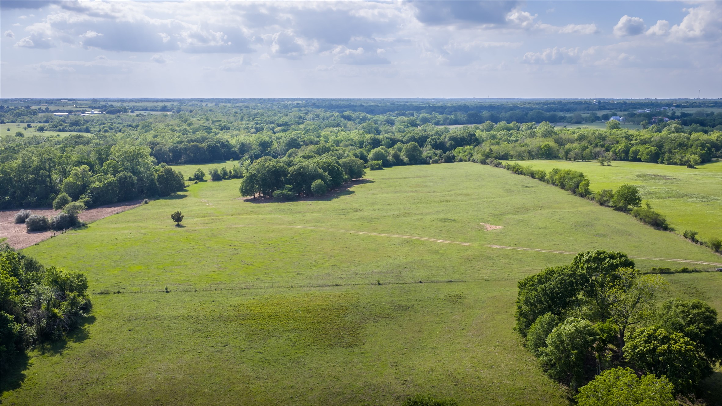 4201 Krueger Road Washington, TX 77880 - Photo 28 of 31 a view of a big yard with an outdoor space and seating