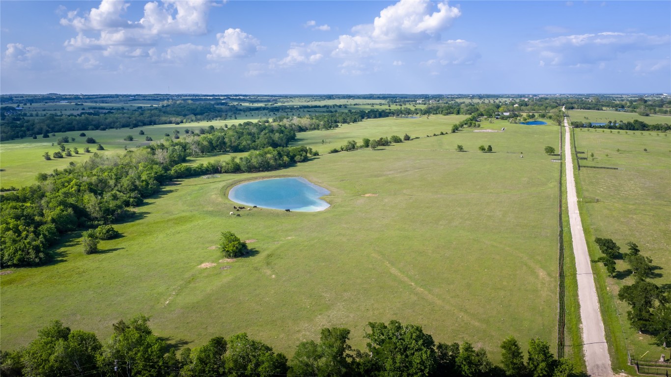 4201 Krueger Road Washington, TX 77880 - Photo 30 of 31 a view of a lake and green valley