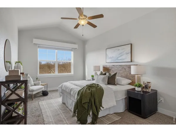 a bedroom with furniture and a window