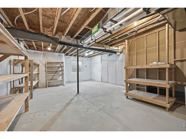 a view of a livingroom with furniture and a window