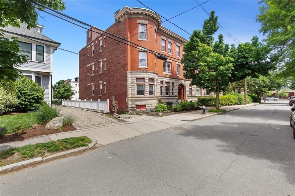 9 Verndale Street, Unit 2 Brookline, MA 02446 - Photo 32 of 39 a front view of a building with a street