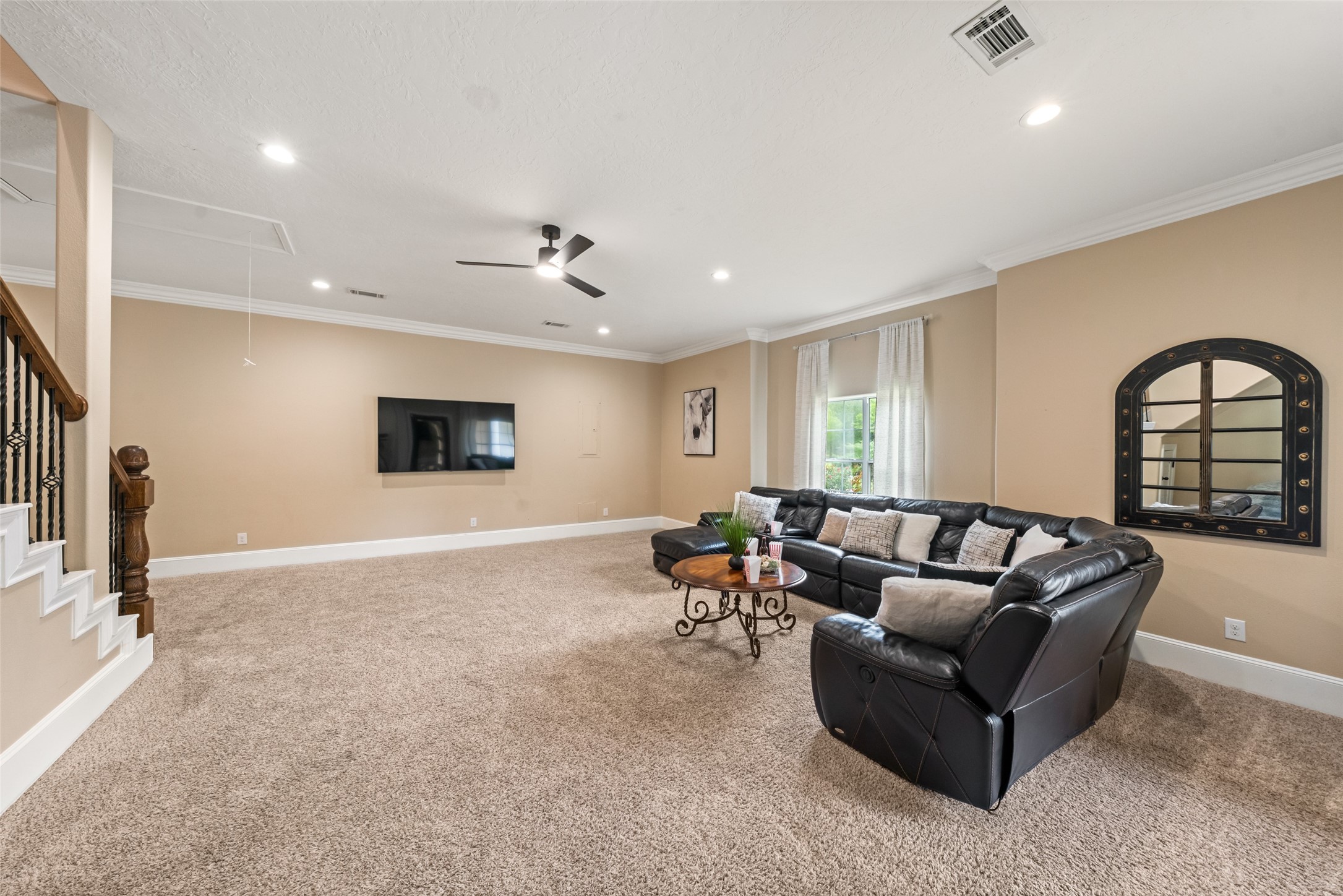 32660 Willow Bend Road Waller, TX 77484 - Photo 18 of 47 Spacious additional living area with recessed lighting, abundant natural light, and a flexible layout for a game room, media space, or casual gathering area.