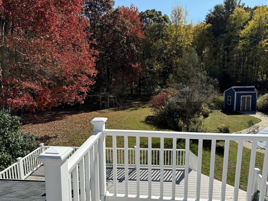 209 Gaffney Road Oakham, MA 01068 - Photo 20 of 42 a view of house with backyard and trees