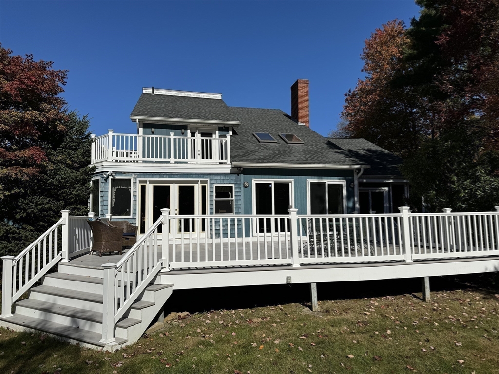 209 Gaffney Road Oakham, MA 01068 - Photo 24 of 42 a front view of a house with a deck