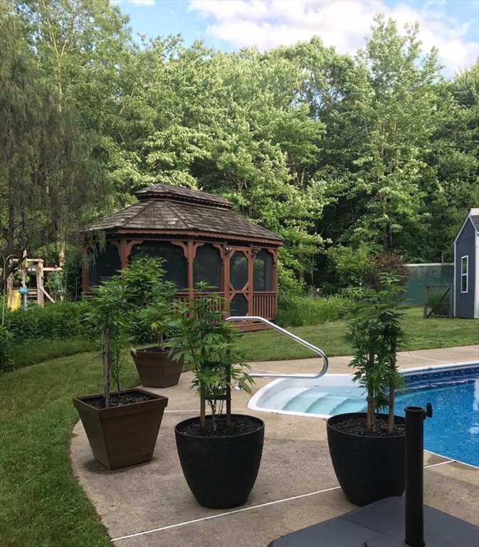 209 Gaffney Road Oakham, MA 01068 - Photo 27 of 42 a view of a house with backyard sitting area and garden