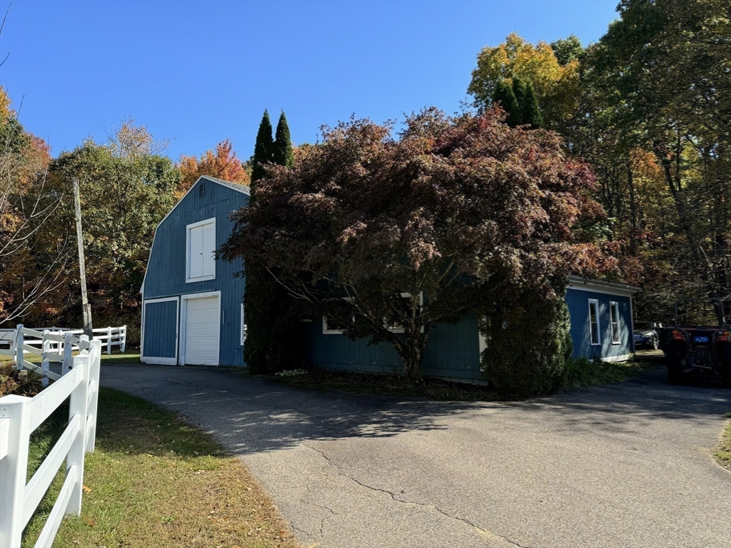 209 Gaffney Road Oakham, MA 01068 - Photo 31 of 42 a view of a house with a yard