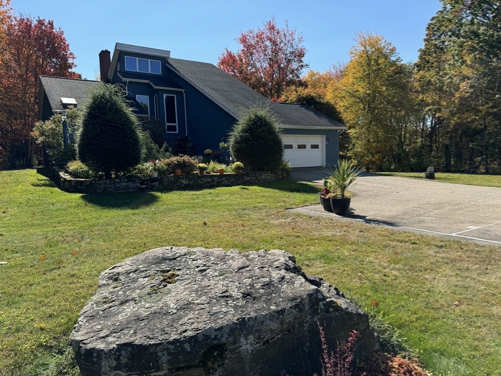 209 Gaffney Road Oakham, MA 01068 - Photo 38 of 42 a view of a house with backyard and sitting area
