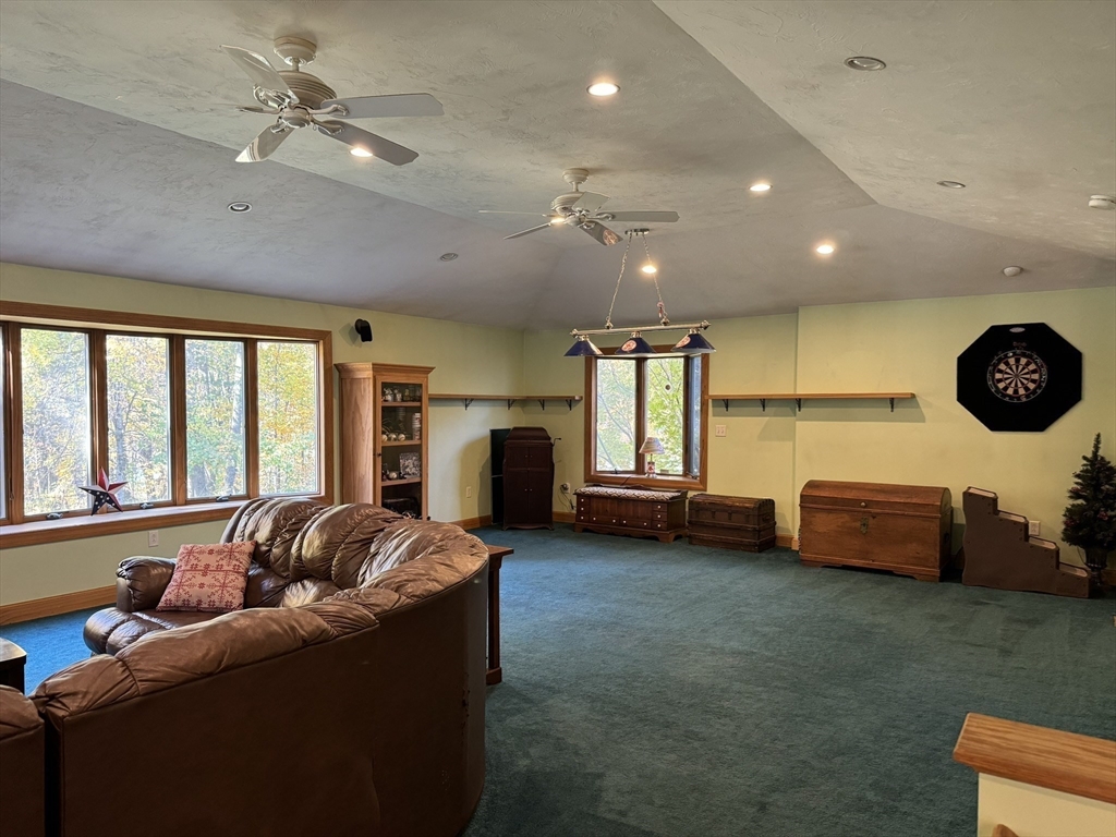 209 Gaffney Road Oakham, MA 01068 - Photo 4 of 42 a living room with furniture and a fireplace