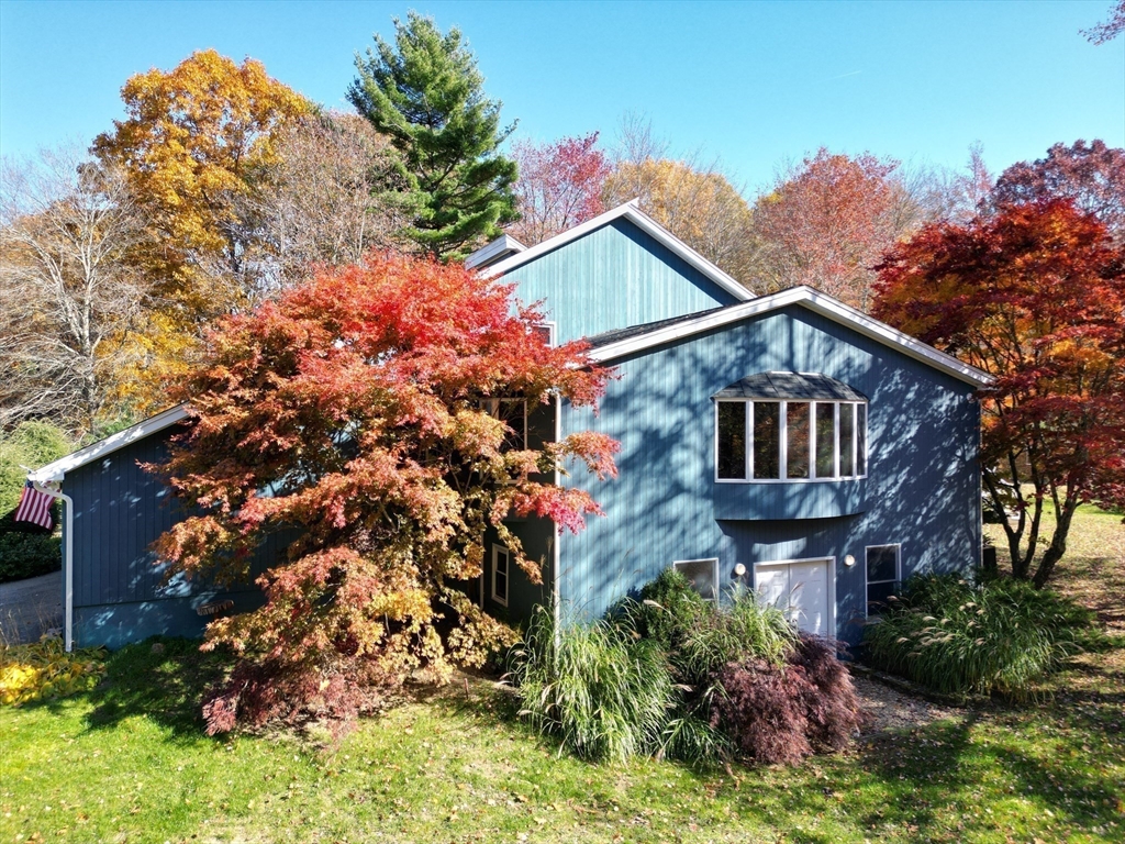 209 Gaffney Road Oakham, MA 01068 - Photo 41 of 42 a front view of a house with a yard