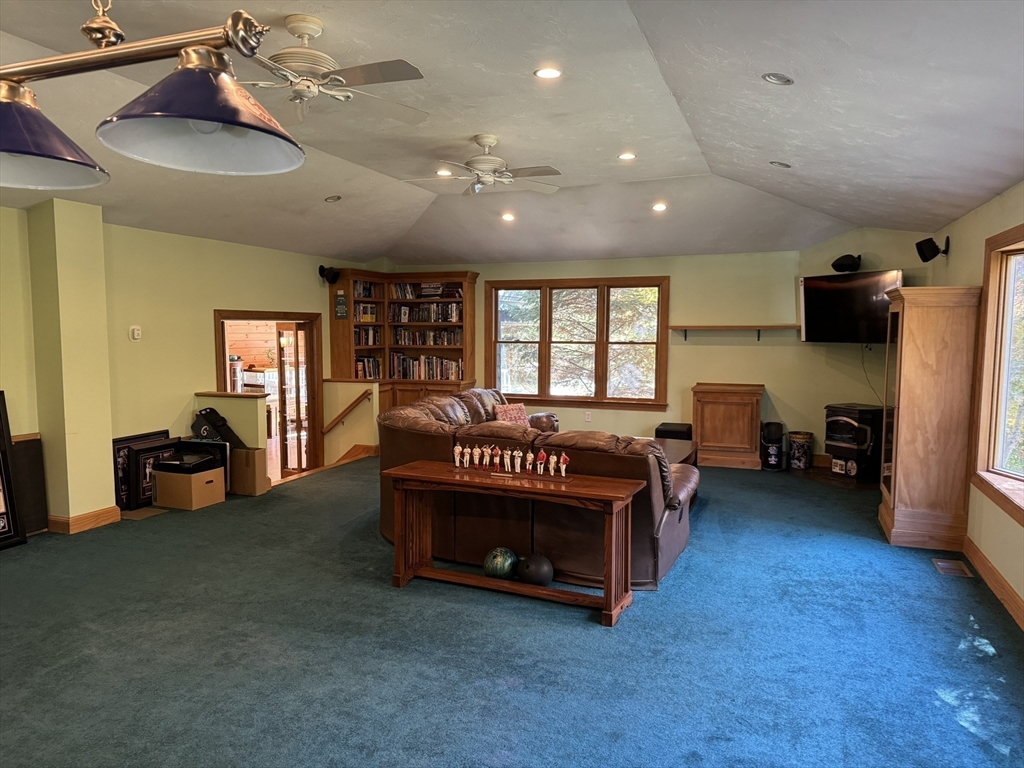 209 Gaffney Road Oakham, MA 01068 - Photo 5 of 42 a view of a livingroom with furniture and a ceiling fan