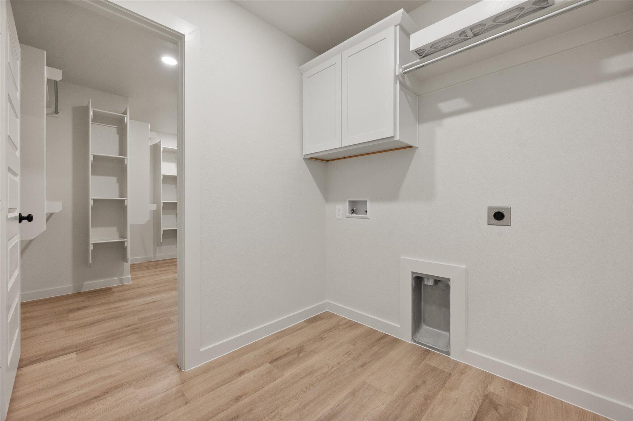 5309 Remington Avenue Lubbock, TX 79407 - Photo 20 of 22 a view of an empty room with wooden floor and a bathroom