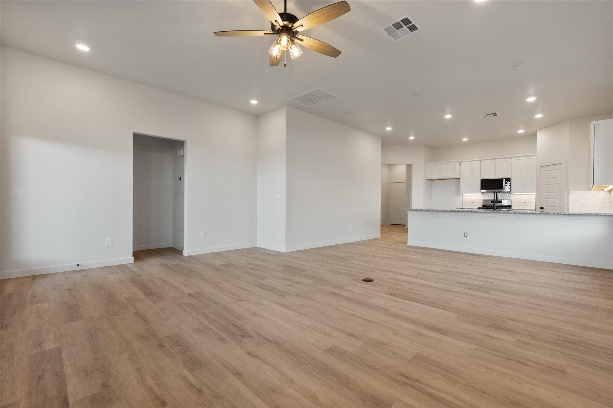 5309 Remington Avenue Lubbock, TX 79407 - Photo 9 of 22 a view of a kitchen with a sink and a refrigerator