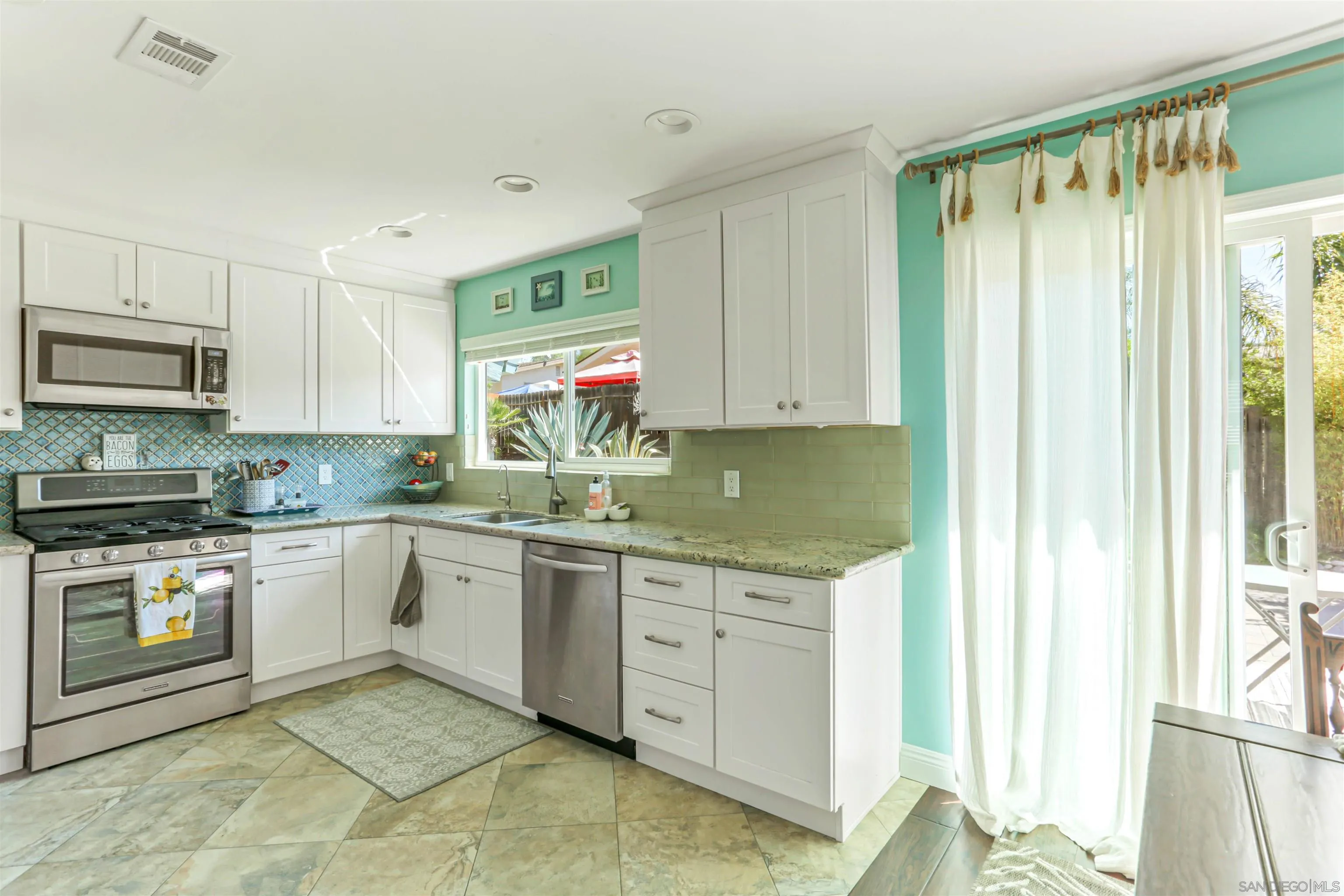 13515 Utopia Road Poway, CA 92064 - Photo 13 of 36 a kitchen with stainless steel appliances granite countertop a stove a sink and a refrigerator