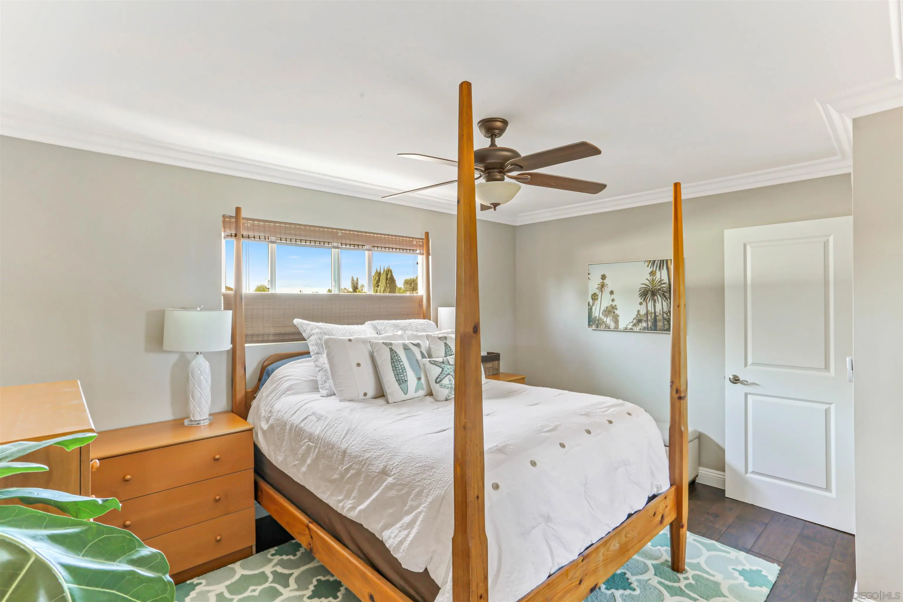 13515 Utopia Road Poway, CA 92064 - Photo 19 of 36 a bedroom with a bed and a chandelier