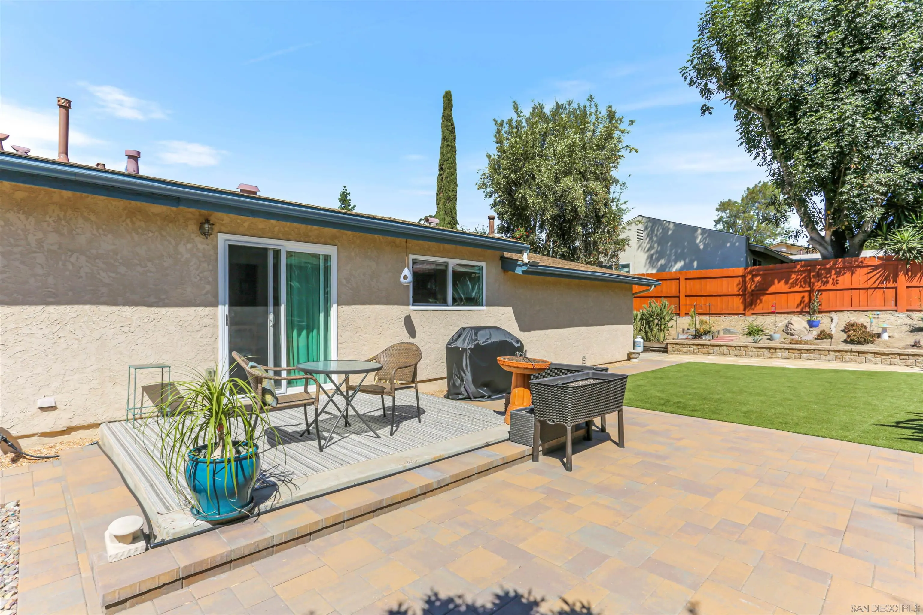 13515 Utopia Road Poway, CA 92064 - Photo 28 of 36 a view of a patio with table and chairs and potted plants