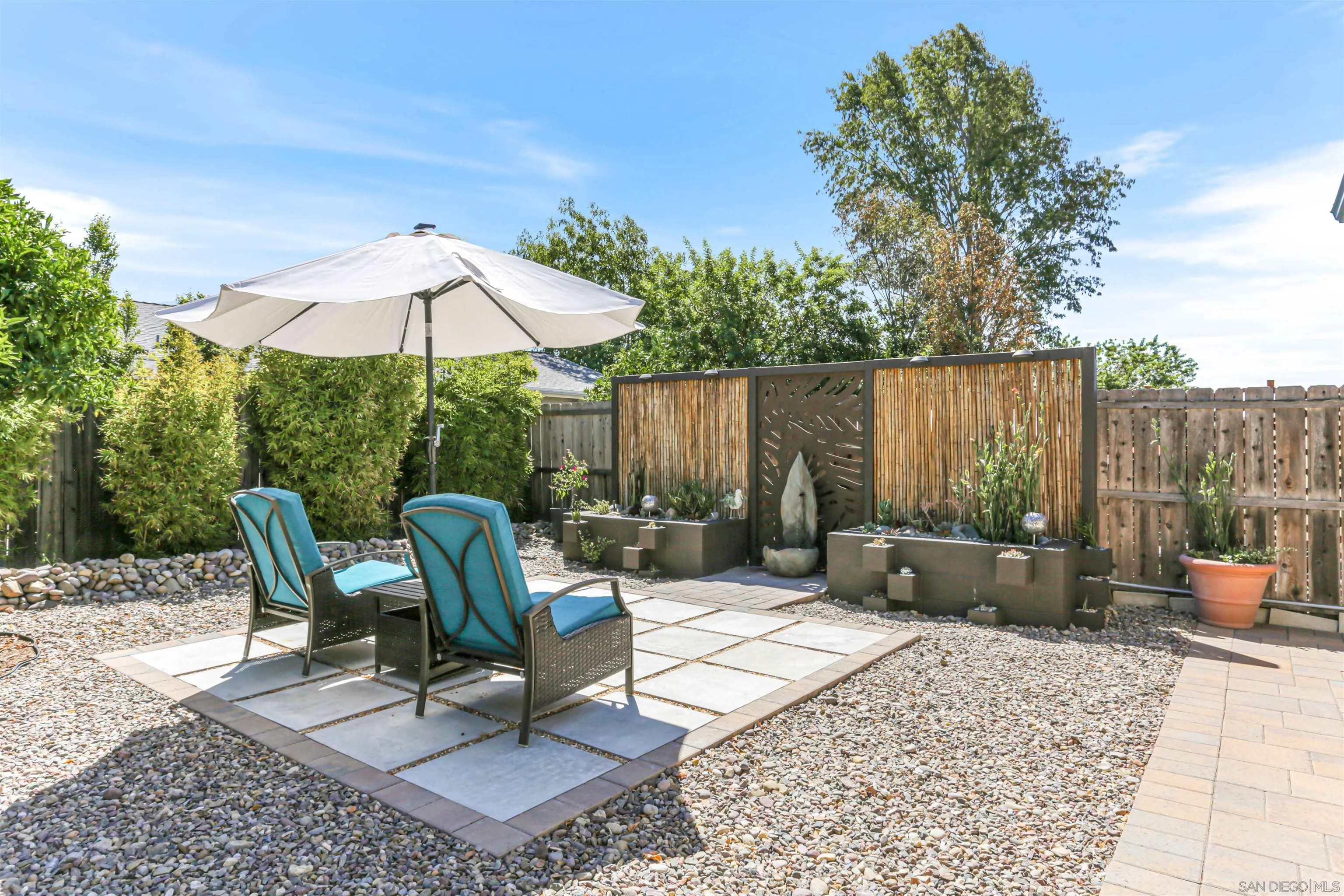13515 Utopia Road Poway, CA 92064 - Photo 29 of 36 a view of a patio with a table chairs and a barbeque