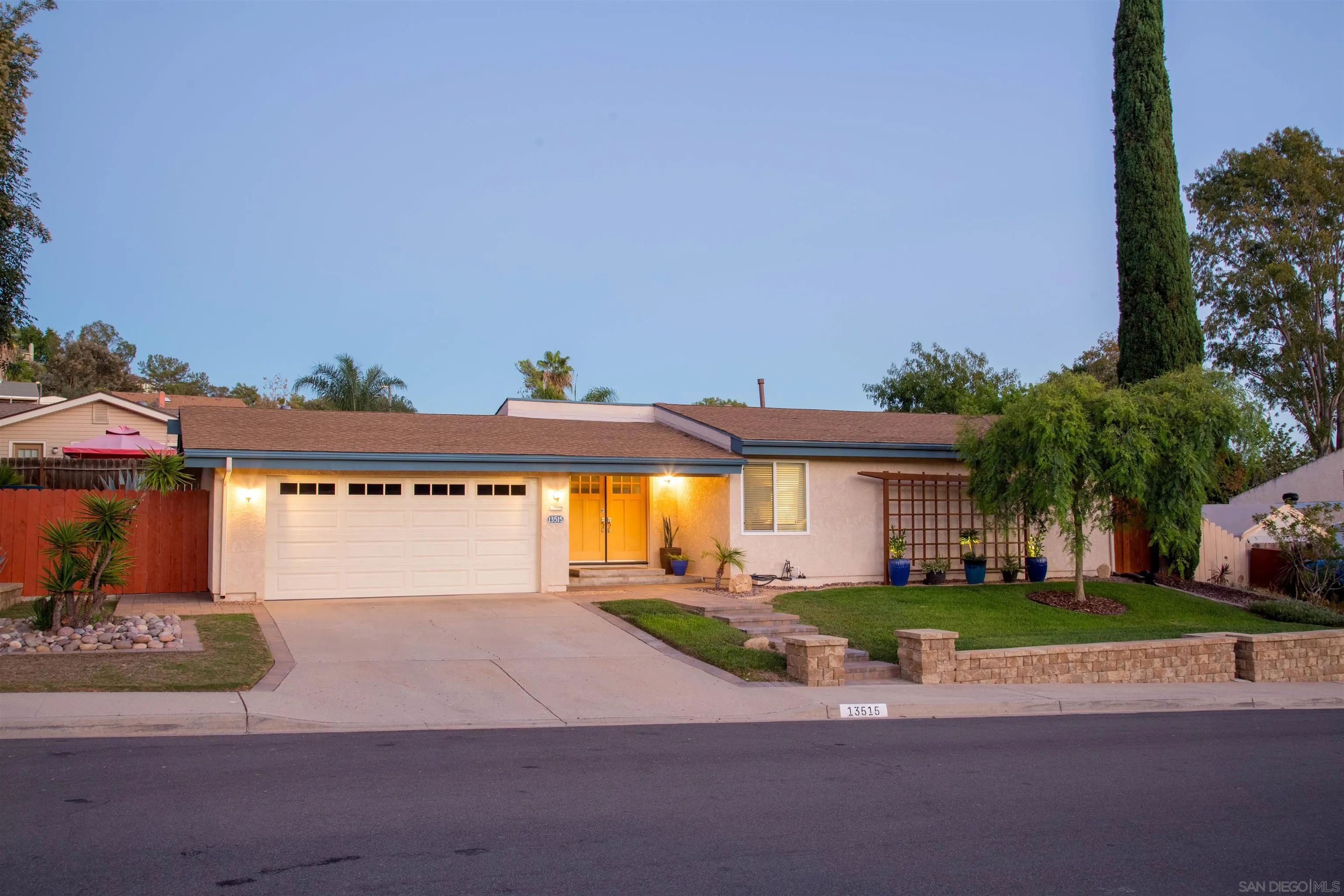 13515 Utopia Road Poway, CA 92064 - Photo 32 of 36 a front view of a house with a garden and yard