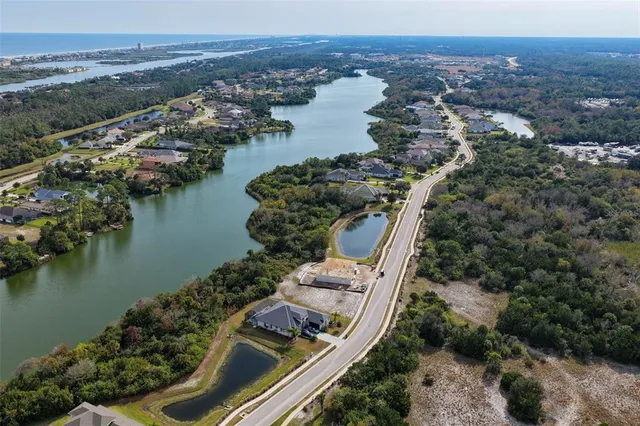 a view of a lake with couches and wooden floor