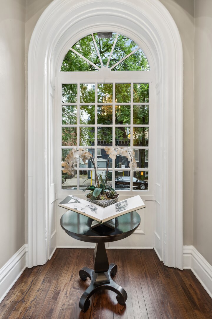 24 West Chestnut Street Chicago, IL 60610 - Photo 18 of 38 a view of a workspace with wooden floor and a window