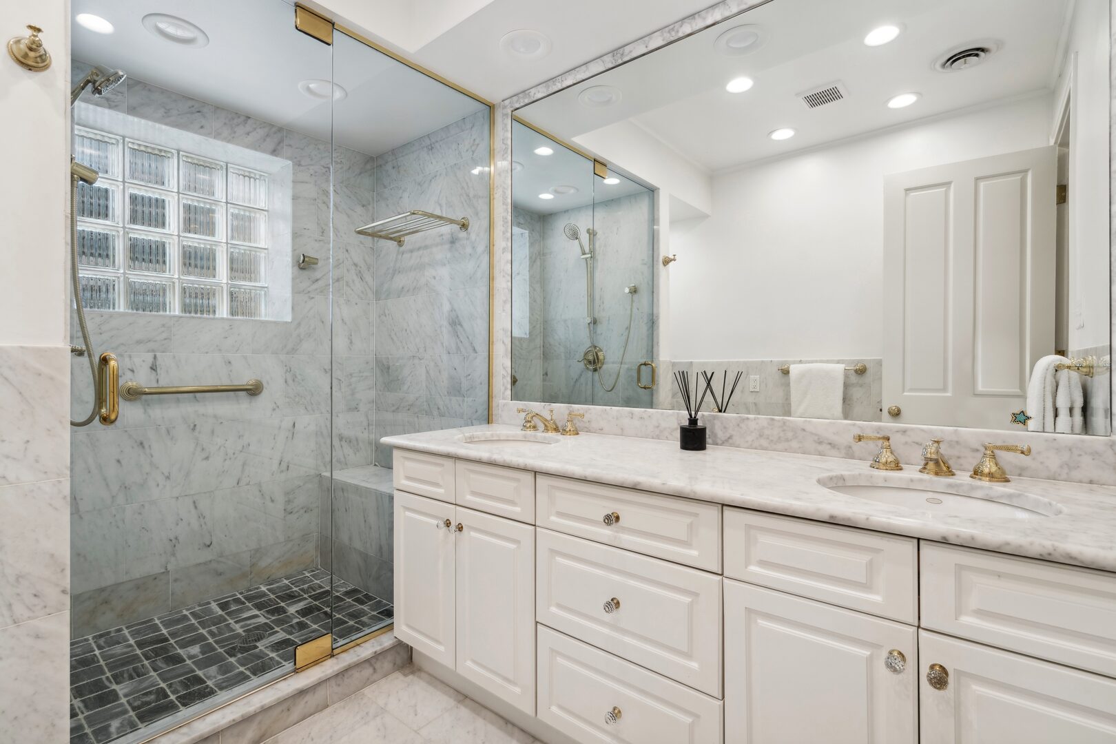 24 West Chestnut Street Chicago, IL 60610 - Photo 21 of 38 a bathroom with a granite countertop sink mirror and double