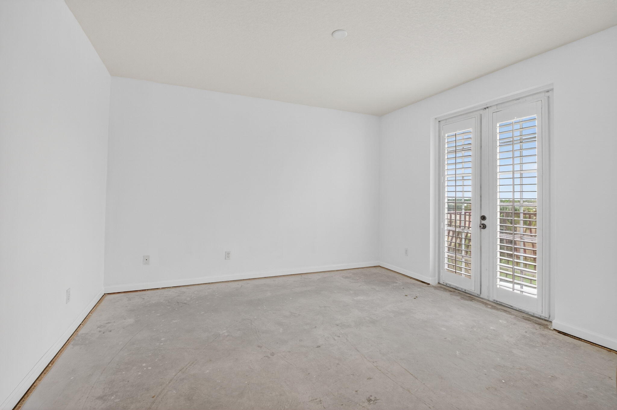 22715 Camino Del Mar, Unit 61 Boca Raton, FL 33433 - Photo 11 of 39 an empty room with windows