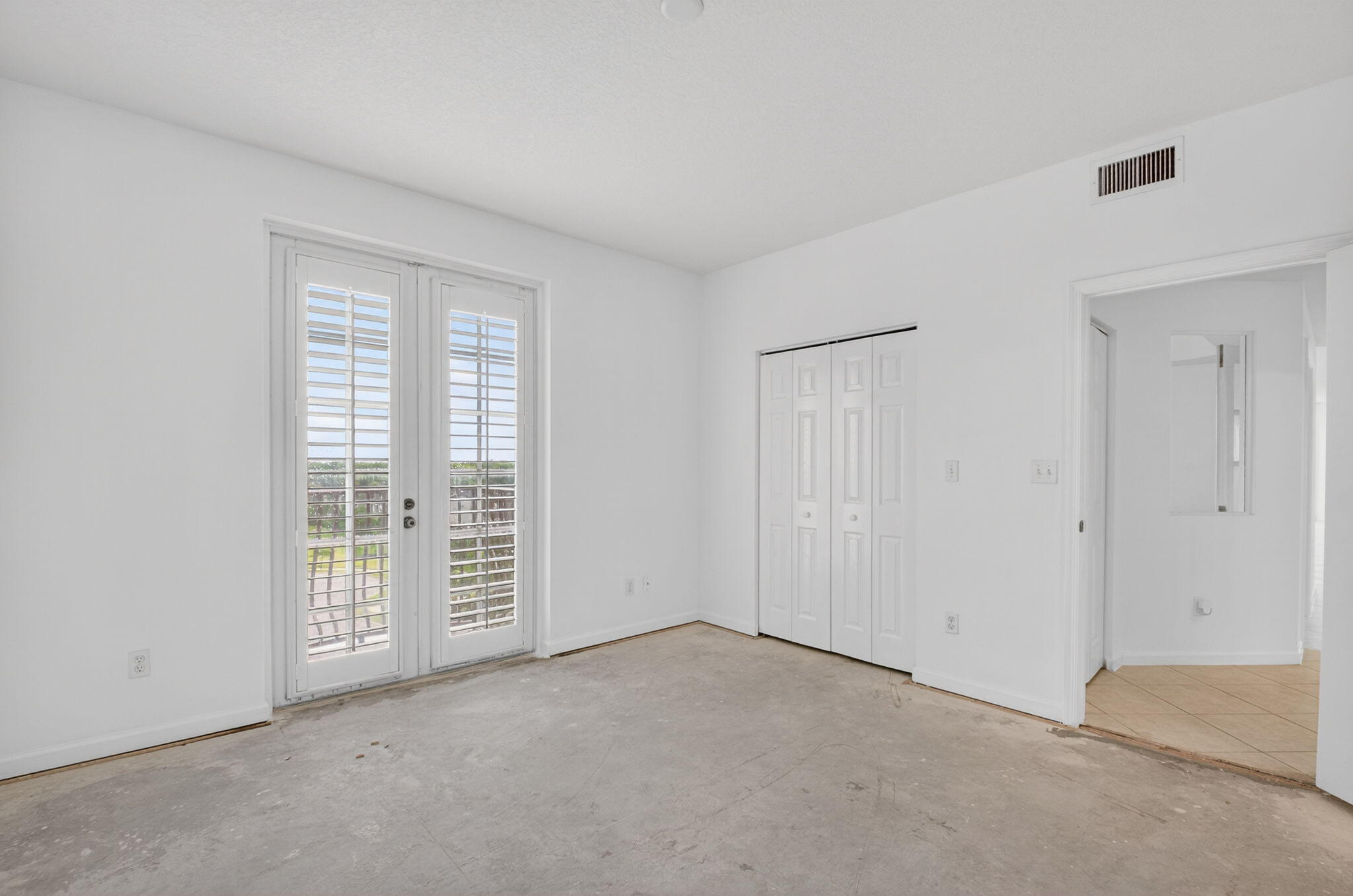 22715 Camino Del Mar, Unit 61 Boca Raton, FL 33433 - Photo 12 of 39 a view of an empty room with a window