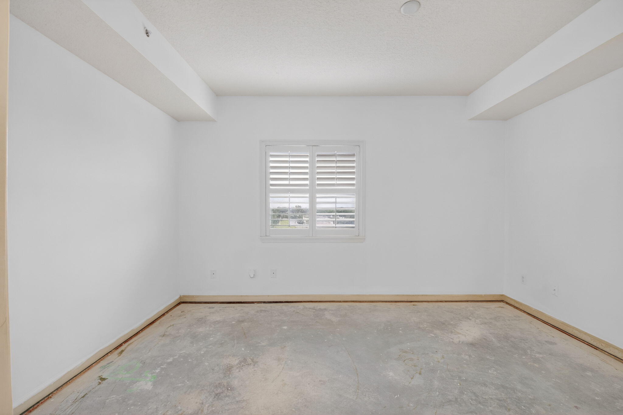 22715 Camino Del Mar, Unit 61 Boca Raton, FL 33433 - Photo 16 of 39 an empty room with a window